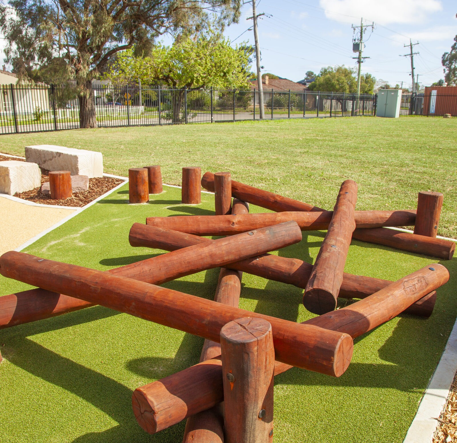 Log Scramble | Challenge young adventurers with our Log Scramble, featuring creatively stacked timber logs that create an engaging obstacle course for climbing, balancing, crawling, and jumping. | VRI