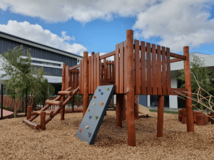 Add a playground centrepiece with this premium West Australian Jarrah fort, featuring multiple climbing challenges, slide, fireman's pole and shop front under.