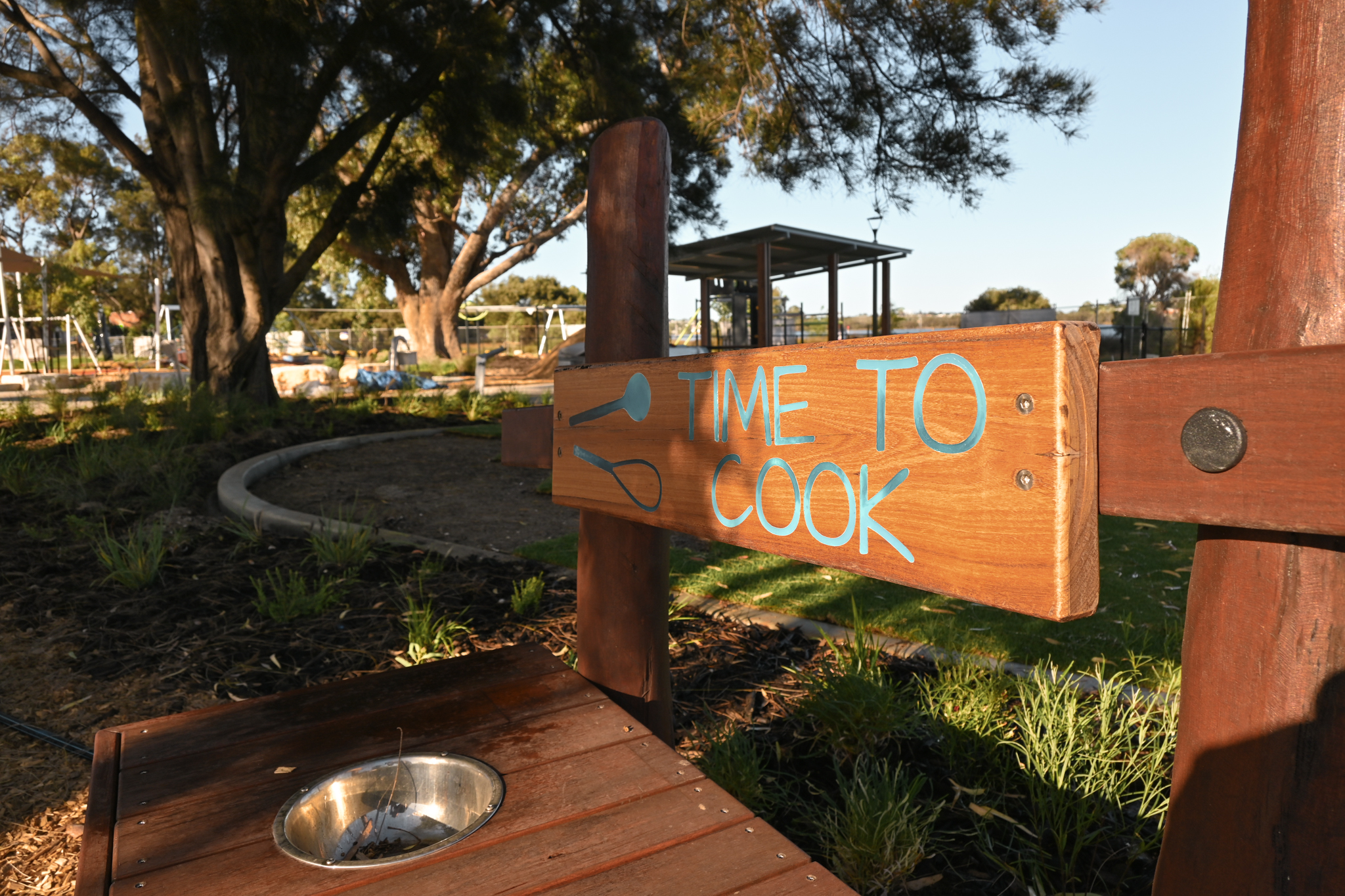 Little Cooker Kitchen | Create culinary adventures with this charming West Australian Jarrah Little Cooker Kitchen, featuring a stainless steel basin and interactive elements for engaging sand and mud play. | VRI