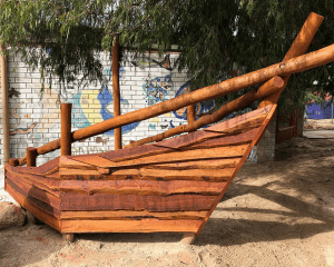 Van Ryt Industries 502-SHI Shipwreck Boat Bow playground structure crafted from West Australian Jarrah with plank and climbing net for pirate themed play areas.
