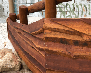 Van Ryt Industries 502-SHI Shipwreck Boat Bow playground structure crafted from West Australian Jarrah with plank and climbing net for pirate themed play areas.