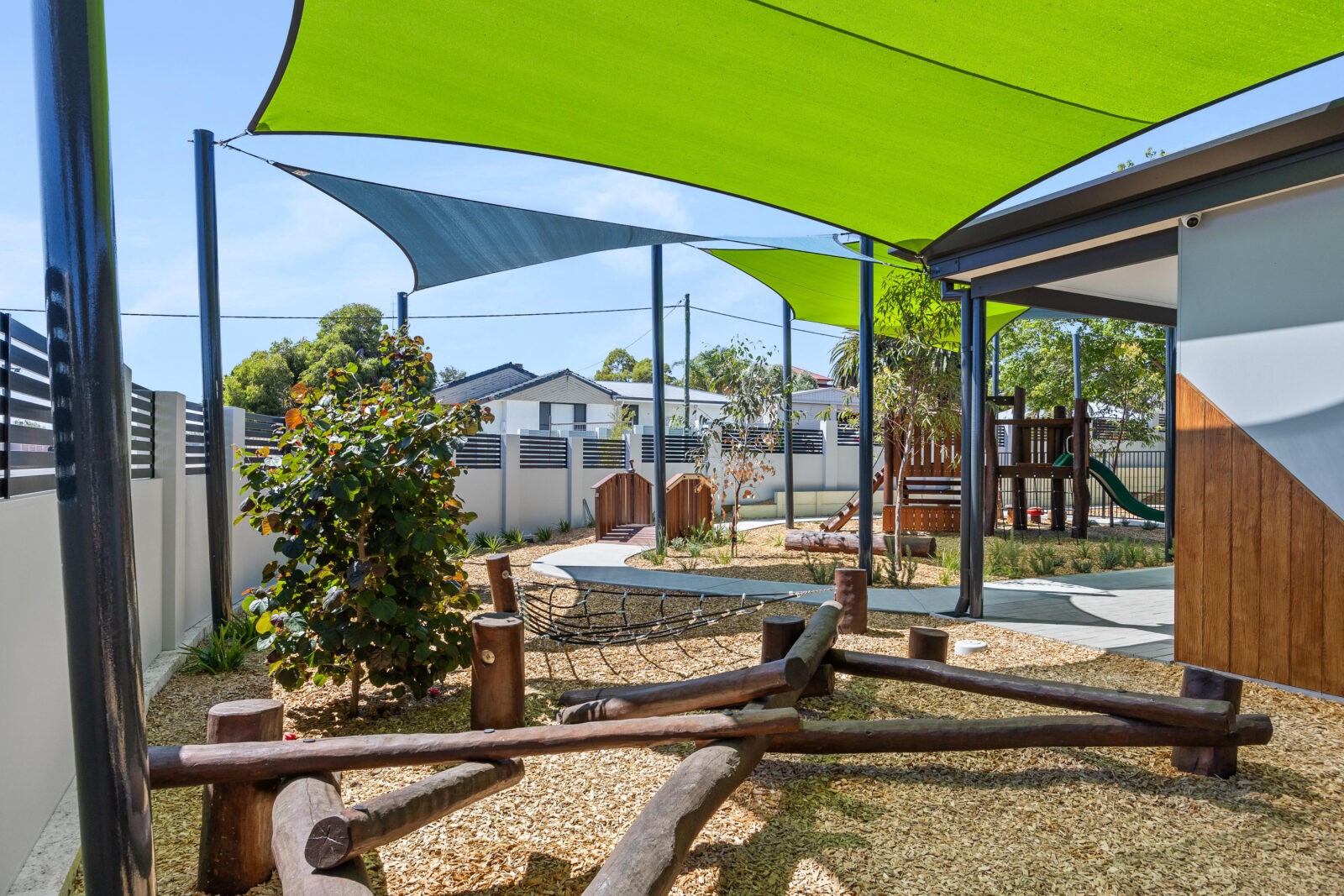 Log Scramble | Challenge young adventurers with our Log Scramble, featuring creatively stacked timber logs that create an engaging obstacle course for climbing, balancing, crawling, and jumping. | VRI