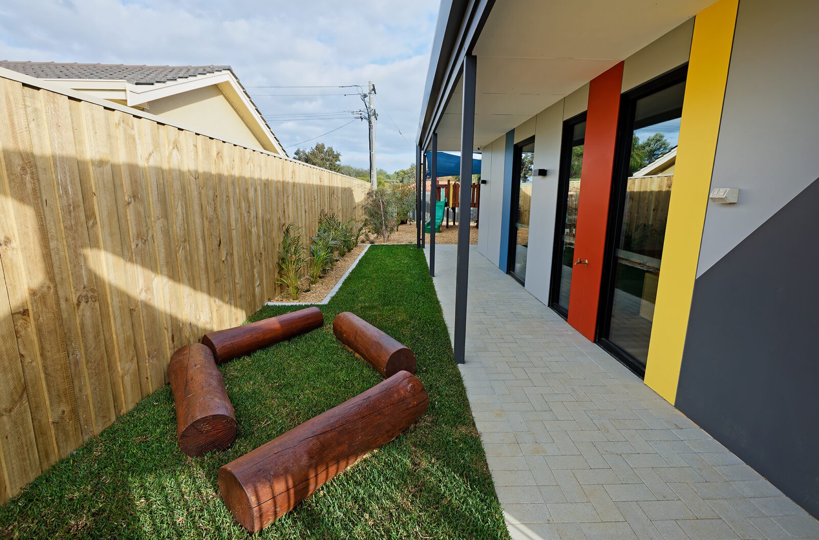 Log | Create engaging play pathways and natural landscape features with our Jarrah logs, perfect for climbing, balancing, and defining playful spaces in outdoor environments. | VRI