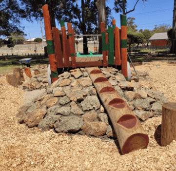 Timber ladder up rock wall Connect playground levels naturally with our Log Steps. Providing both climbing challenges, stepped access and creating engaging pathways through your play space.connecting to timber play fort
