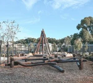 Log Scramble | Challenge young adventurers with our Log Scramble, featuring creatively stacked timber logs that create an engaging obstacle course for climbing, balancing, crawling, and jumping. | VRI