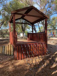 Maximize the use of your sloped site with our innovative Takari Cubby platform, featuring ground-level access and challenging rope climbs leading to a shaded elevated deck crafted from West Australian Jarrah.