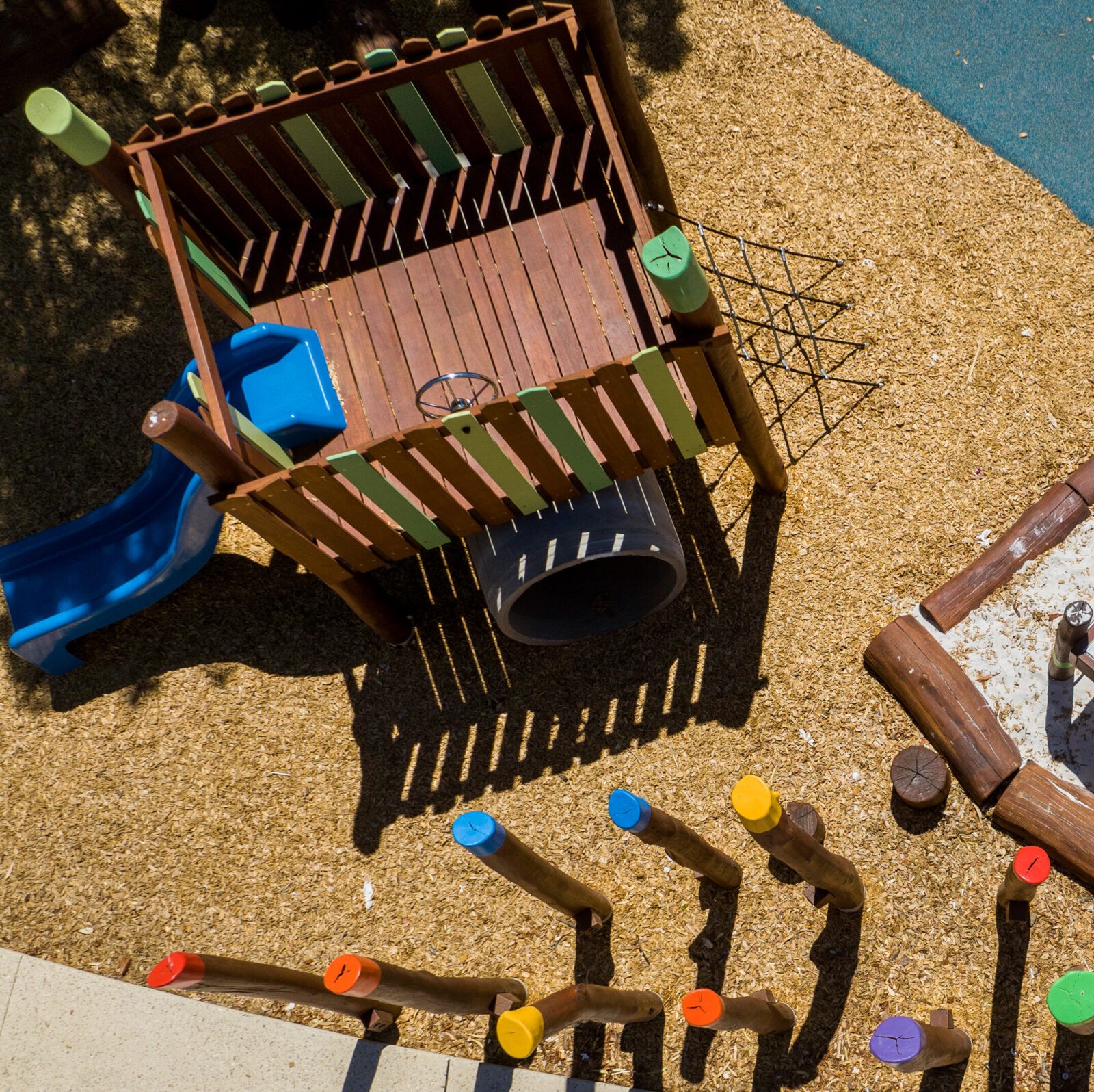 Beldon Platform | Discover the Beldon Platform structure, featuring an cool concrete tunnel retreat, elevated play deck, and climbing challenges crafted from West Australian Jarrah. | VRI