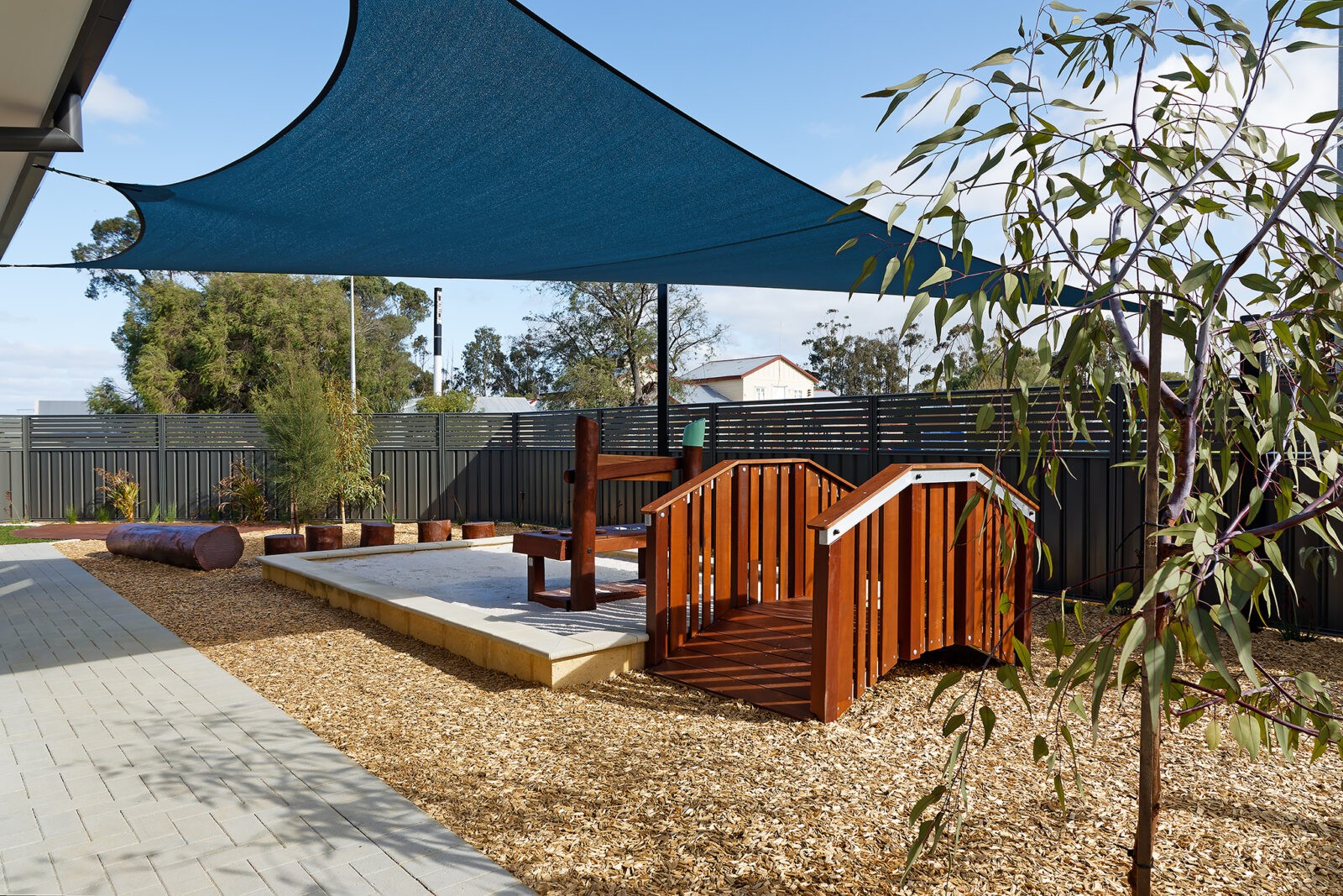 Bridge Type A | Create pathway connections with our Bridge Type A, featuring gentle arch style design, Jarrah hardwood and robust aluminium framework for accessible playground transitions. | VRI