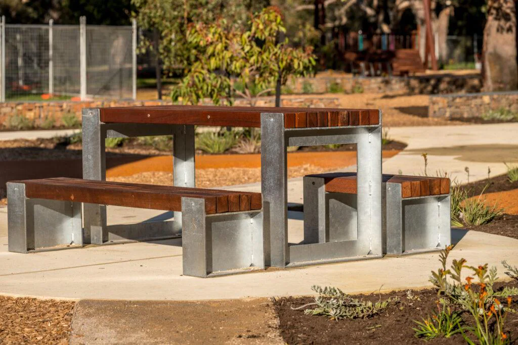 Picnic Table Type B | Create inviting gathering spaces with this classic picnic table, featuring integrated benches, durable West Australian Jarrah battens, and a robust steel frame for parks and schools. | VRI