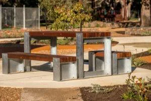 Picnic Table Type B | Create inviting gathering spaces with this classic picnic table, featuring integrated benches, durable West Australian Jarrah battens, and a robust steel frame for parks and schools. | VRI