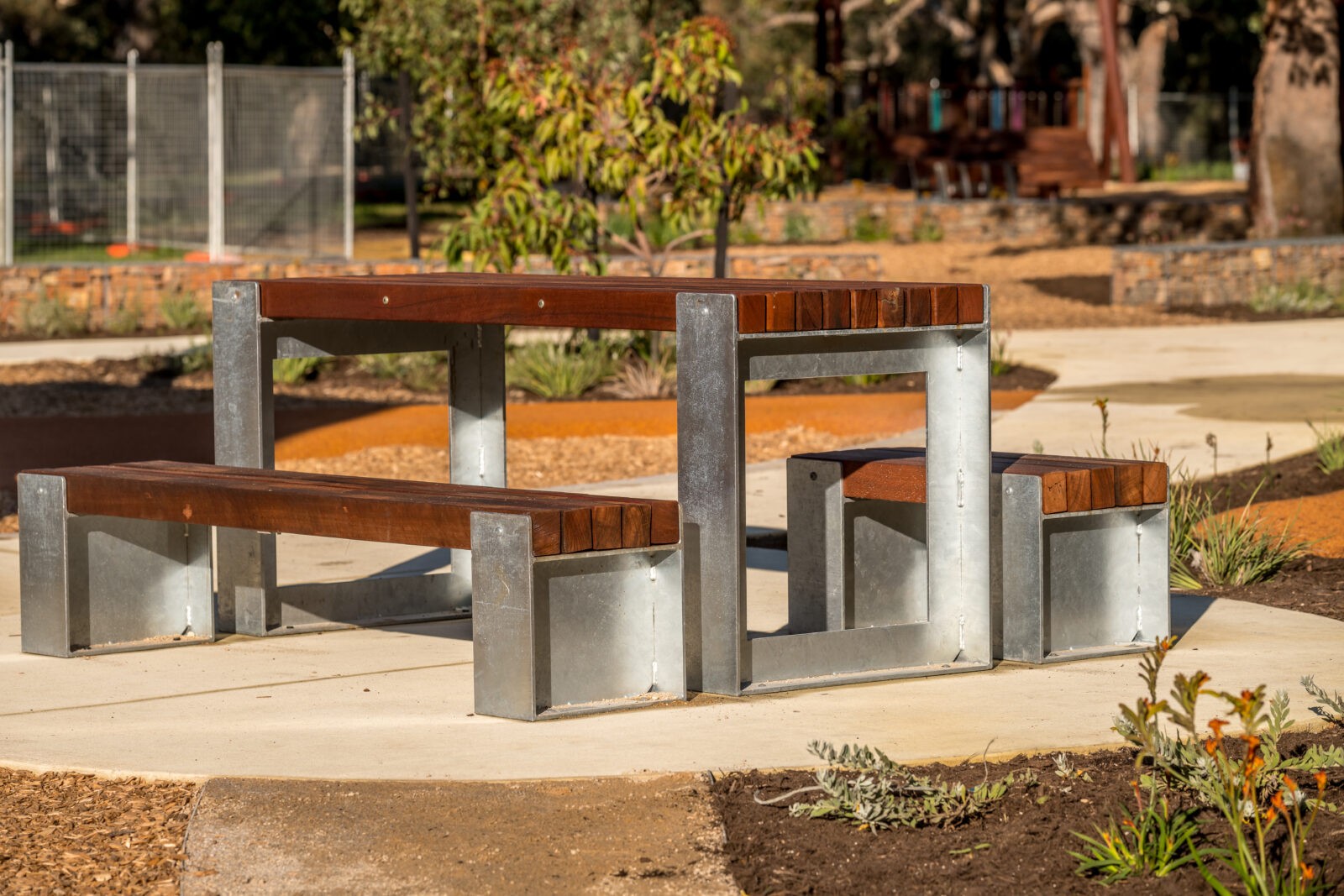 Picnic Table Type B | Create inviting gathering spaces with this classic picnic table, featuring integrated benches, durable West Australian Jarrah battens, and a robust steel frame for parks and schools. | VRI