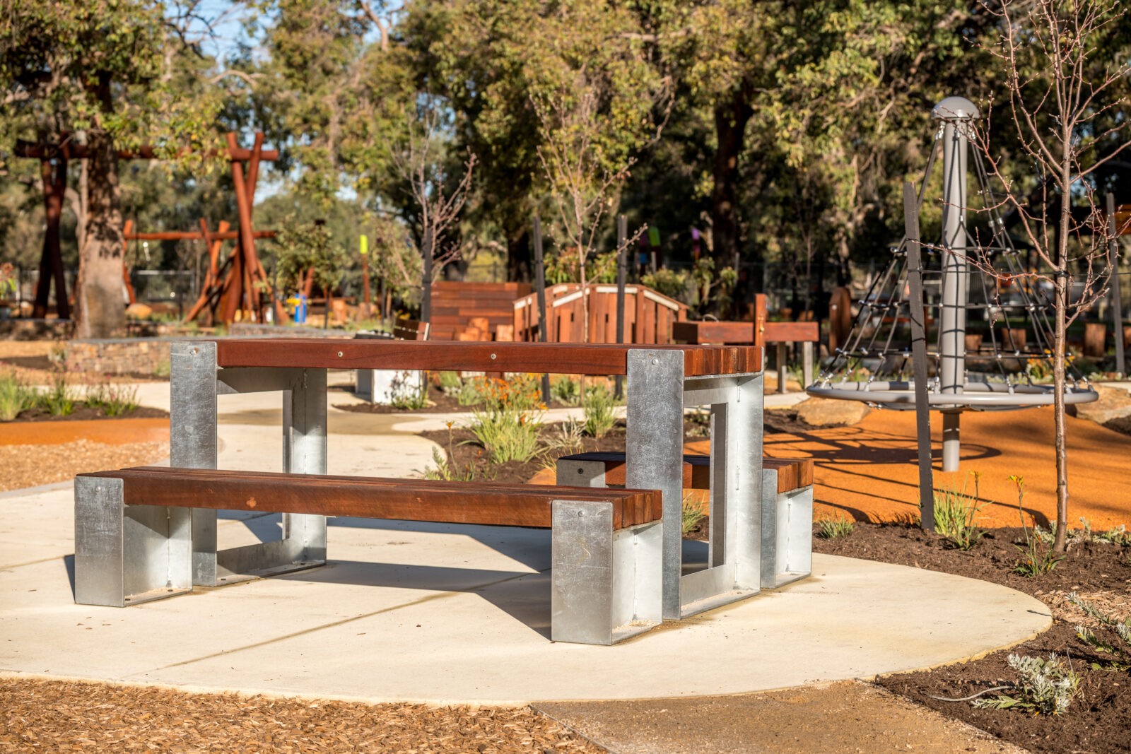 Picnic Table Type B | Create inviting gathering spaces with this classic picnic table, featuring integrated benches, durable West Australian Jarrah battens, and a robust steel frame for parks and schools. | VRI