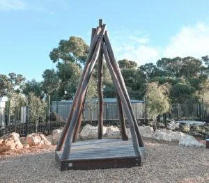 Tee Pee with Accessible Deck | Create versatile play and gathering spaces with our Tee Pee with Accessible Deck semi-sheltered with natural timber poles to provide an elevated space that children can call their own while staying safely in view | VRI