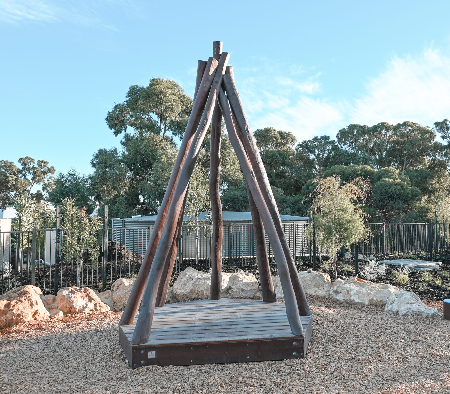 Tee Pee with Accessible Deck | Create versatile play and gathering spaces with our Tee Pee with Accessible Deck semi-sheltered with natural timber poles to provide an elevated space that children can call their own while staying safely in view | VRI