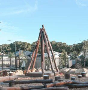 Tee Pee with Accessible Deck | Create versatile play and gathering spaces with our Tee Pee with Accessible Deck semi-sheltered with natural timber poles to provide an elevated space that children can call their own while staying safely in view | VRI