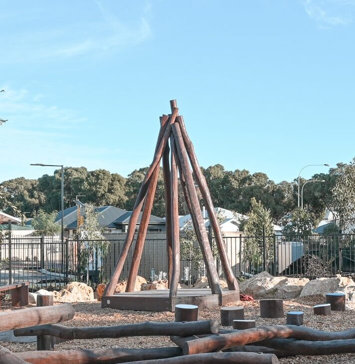 Tee Pee with Accessible Deck | Create versatile play and gathering spaces with our Tee Pee with Accessible Deck semi-sheltered with natural timber poles to provide an elevated space that children can call their own while staying safely in view | VRI