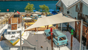 Aerial overview of VRI custom playground design at Gage Roads Brewery Fremantle — crayfishing boat and Car in sand courtyard.