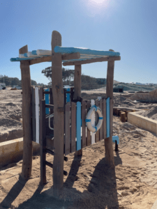 Beach Shack Type A | Transport children to seaside adventures with our Beach Shack, featuring whitewashed timber, natural edge roofing, and coastal-themed elements that inspire imaginative maritime play. | VRI
