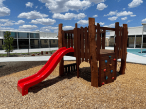 Burnsy Cubby | Discover our multi-activity Burnsy Cubby, featuring diverse climbing challenges, a tunnel hideaway, and colourful slide that create a play hub for active exploration. | VRI