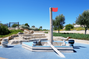 Boat | Set sail for fun with this cute moored Boat play structure, featuring WA Jarrah, steering wheel, sail mast, balancing rope pier, and oars for nautical adventures. | VRI