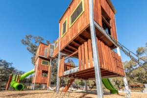 Transform your playground with our towering 8.7-metre adventure structure, featuring multiple climbing challenges, mesh-enclosed walkways, and an exhilarating giant tube slide for the ultimate play experience.