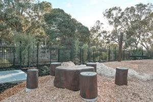 Stump Picnic Setting | Create natural gathering spaces with our Stump Picnic Setting, featuring locally sourced West Australian Jarrah hardwood stumps arranged in a social configuration perfect for outdoor learning and play. | VRI