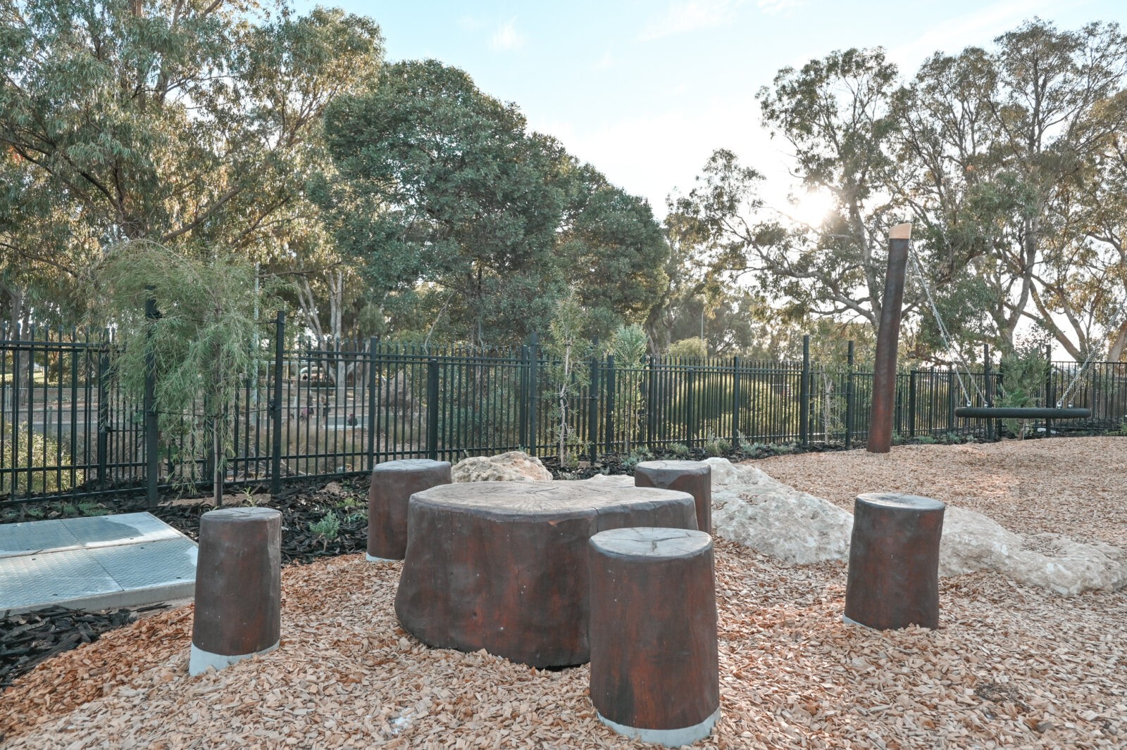 Stump Picnic Setting | Create natural gathering spaces with our Stump Picnic Setting, featuring locally sourced West Australian Jarrah hardwood stumps arranged in a social configuration perfect for outdoor learning and play. | VRI
