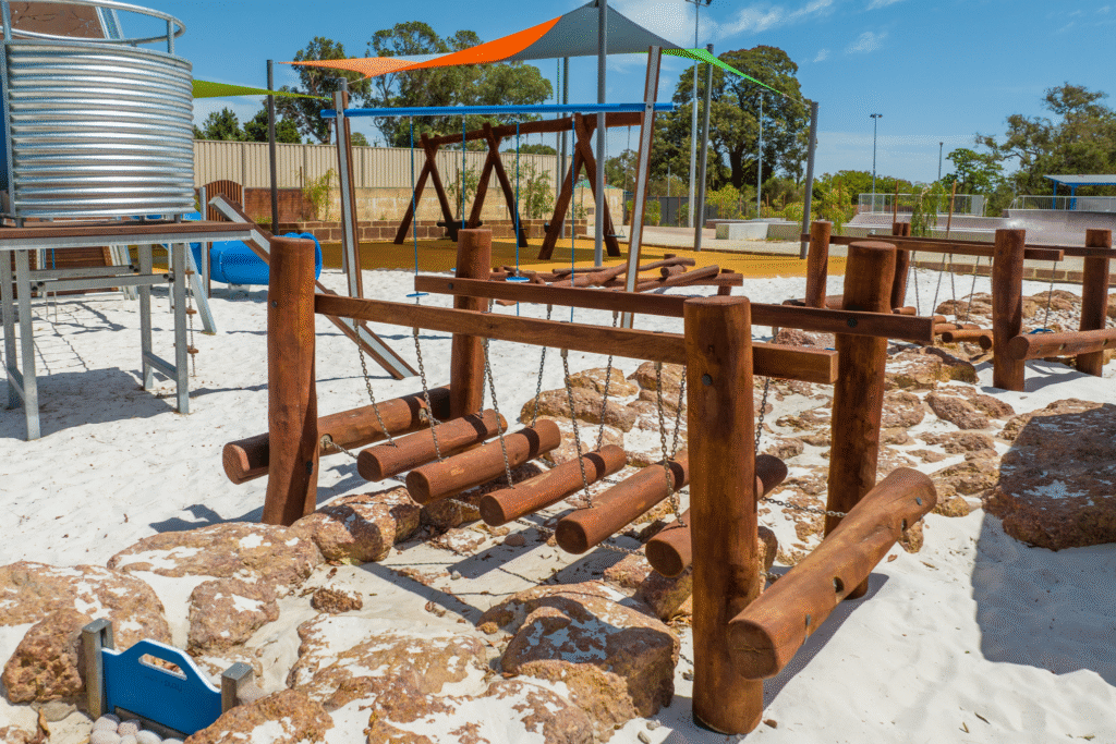 Floating Logs Walk | Challenge balance and coordination with our Floating Log Walk, featuring swaying timber logs for a dynamic playground pathways that will develop confidence and spatial awareness. | VRI