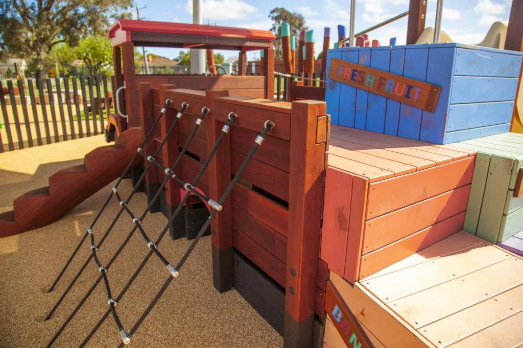 Loaded Fruit Truck | Experience feature-packed fun with the Loaded Fruit Truck, boasting colourful stacked crate climbers, nets, slide, log steps, and a unique under-tray tunnel. | VRI