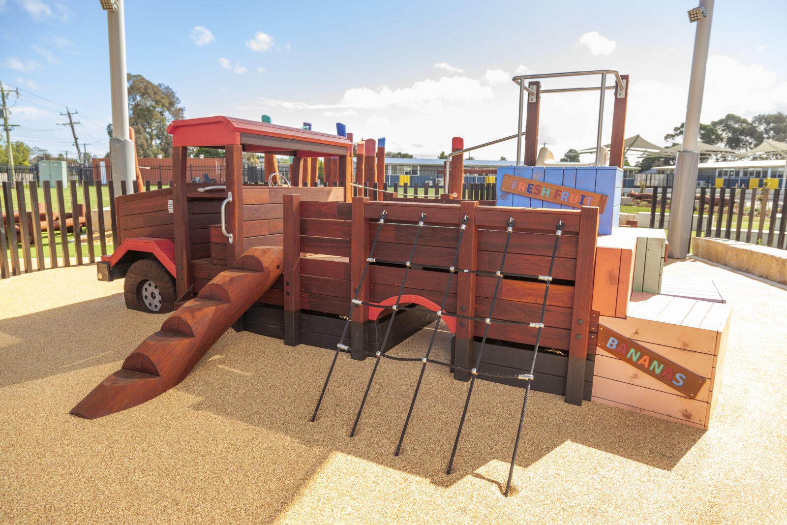 Loaded Fruit Truck | Experience feature-packed fun with the Loaded Fruit Truck, boasting colourful stacked crate climbers, nets, slide, log steps, and a unique under-tray tunnel. | VRI