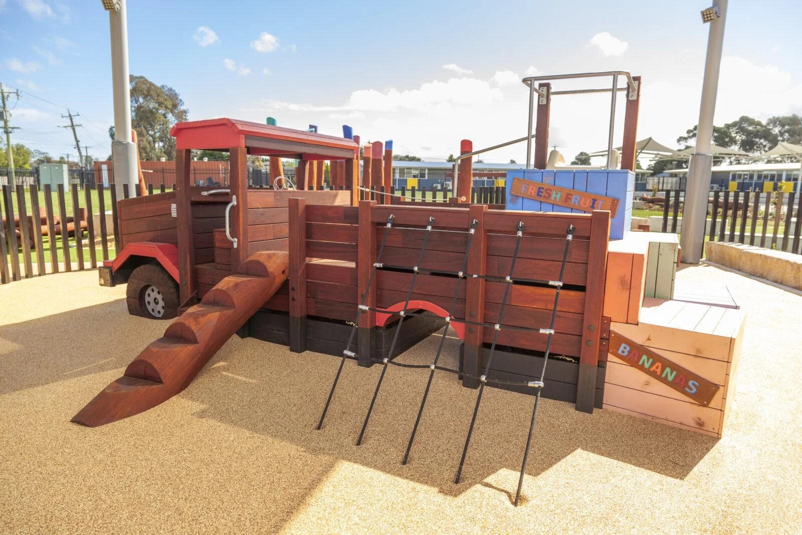Loaded Fruit Truck | Experience feature-packed fun with the Loaded Fruit Truck, boasting colourful stacked crate climbers, nets, slide, log steps, and a unique under-tray tunnel. | VRI