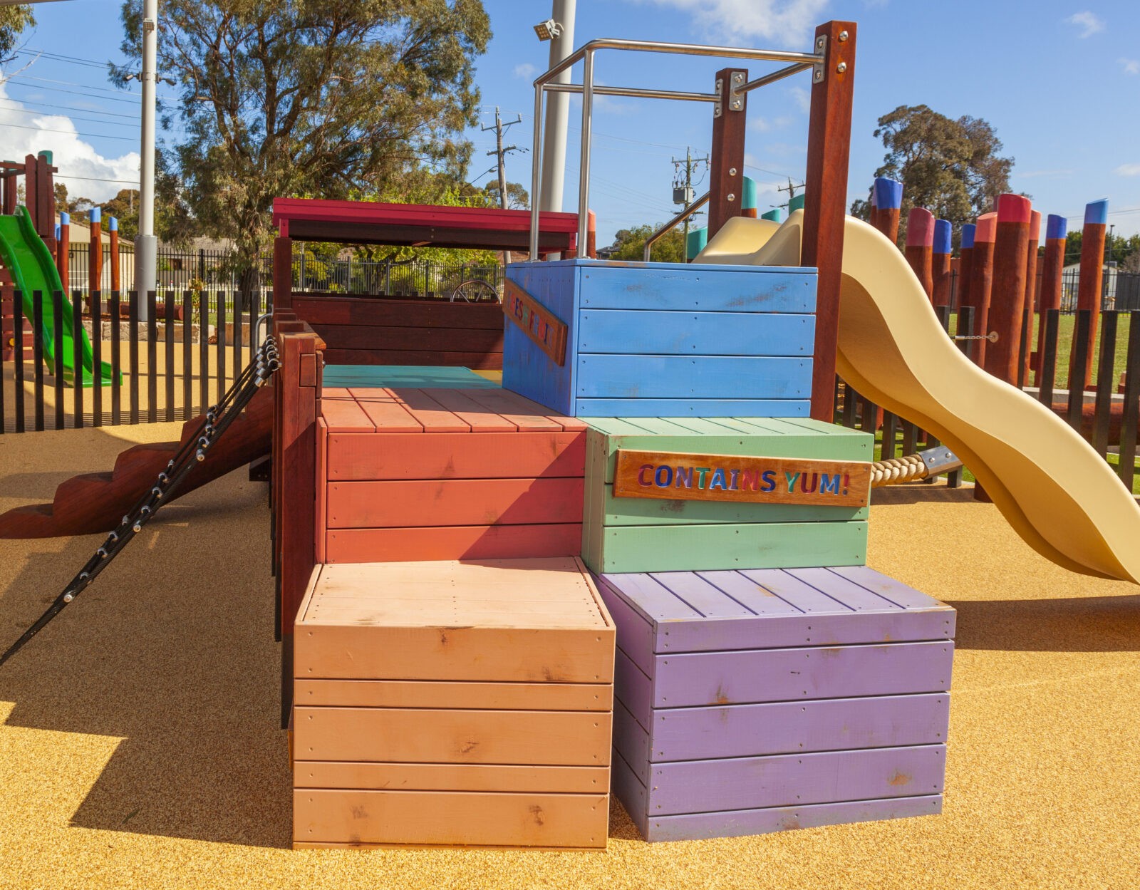 Loaded Fruit Truck | Experience feature-packed fun with the Loaded Fruit Truck, boasting colourful stacked crate climbers, nets, slide, log steps, and a unique under-tray tunnel. | VRI