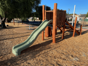 Bentley Climber | Challenge young adventurers with our Bentley Climber, featuring natural timber cladding, rope net and log scramble access to an elevated 1500mm platform. | VRI