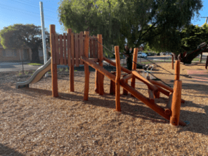Bentley Climber | Challenge young adventurers with our Bentley Climber, featuring natural timber cladding, rope net and log scramble access to an elevated 1500mm platform. | VRI