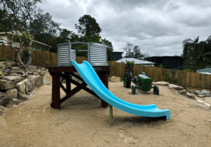 Inspired by iconic Australian outback water tank stand, this unique fort combines adventure and imagination with a 1600mm elevated platform, rope net access, and curved slide.