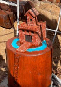 Fairy Castle Stump | Create an enchanted play space with our Fairy Castle Stump, featuring intricate castle-themed carvings on a natural timber stump for magical play experiences. | VRI
