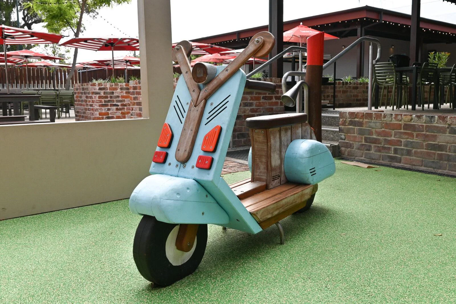 Custom moped play element at The Bayswater Hotel pub playground Perth — handcrafted timber and painted scooter
