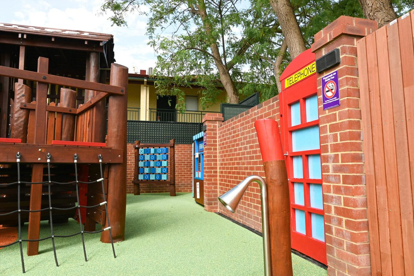 Outdoor play space at The Bayswater Hotel — rope climb, custom phone booth wall, and streetscape features, Bayswater WA