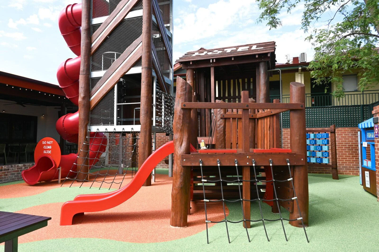 Custom pub playground Perth — triple tower play structure with tube slide and rope bridge at The Bayswater Hotel