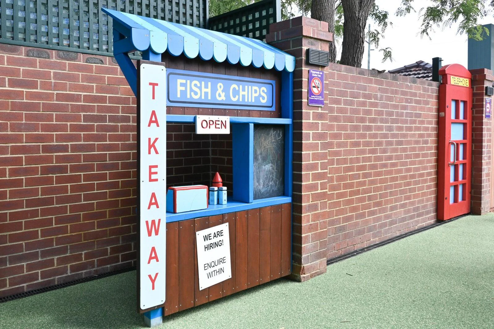 Custom streetscape play elements at The Bayswater Hotel — fish and chips kiosk and phone booth, Bayswater WA