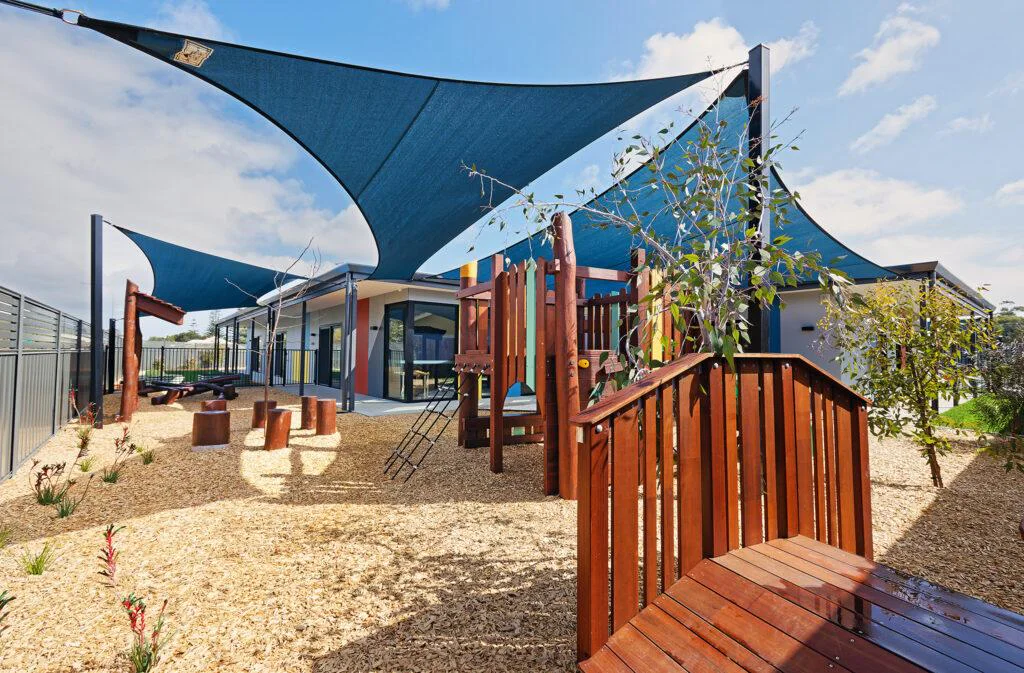 Custom timber bus playground at Bush Kids Childcare and Early Education — built by Van Ryt Industries WA