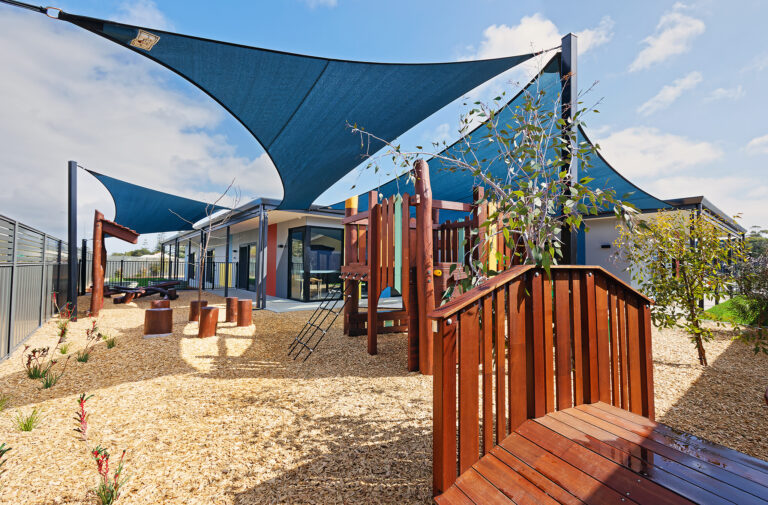 Custom timber bus playground at Bush Kids Childcare and Early Education — built by Van Ryt Industries WA