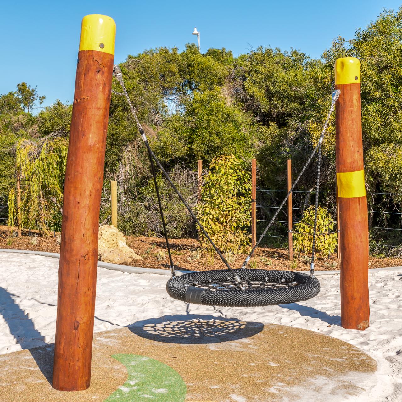 Double Pole Basket Swing | Offer robust, inclusive swinging with this Double Pole Basket Swing, featuring a sturdy Jarrah bush pole frame and a large basket seat ideal for high-use public spaces. | VRI