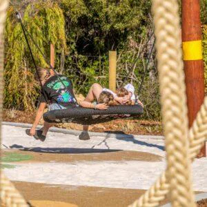 Double Pole Basket Swing | Offer robust, inclusive swinging with this Double Pole Basket Swing, featuring a sturdy Jarrah bush pole frame and a large basket seat ideal for high-use public spaces. | VRI