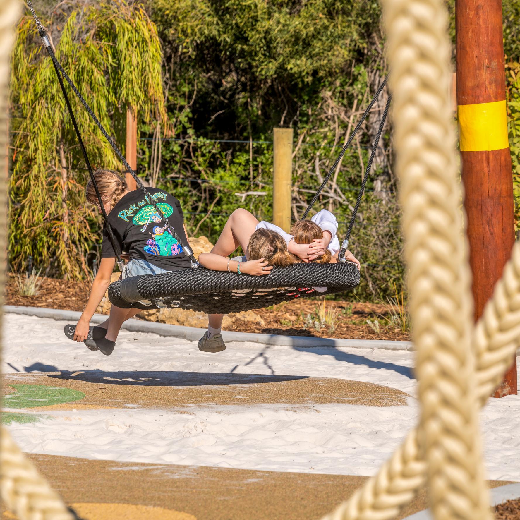 Double Pole Basket Swing | Offer robust, inclusive swinging with this Double Pole Basket Swing, featuring a sturdy Jarrah bush pole frame and a large basket seat ideal for high-use public spaces. | VRI