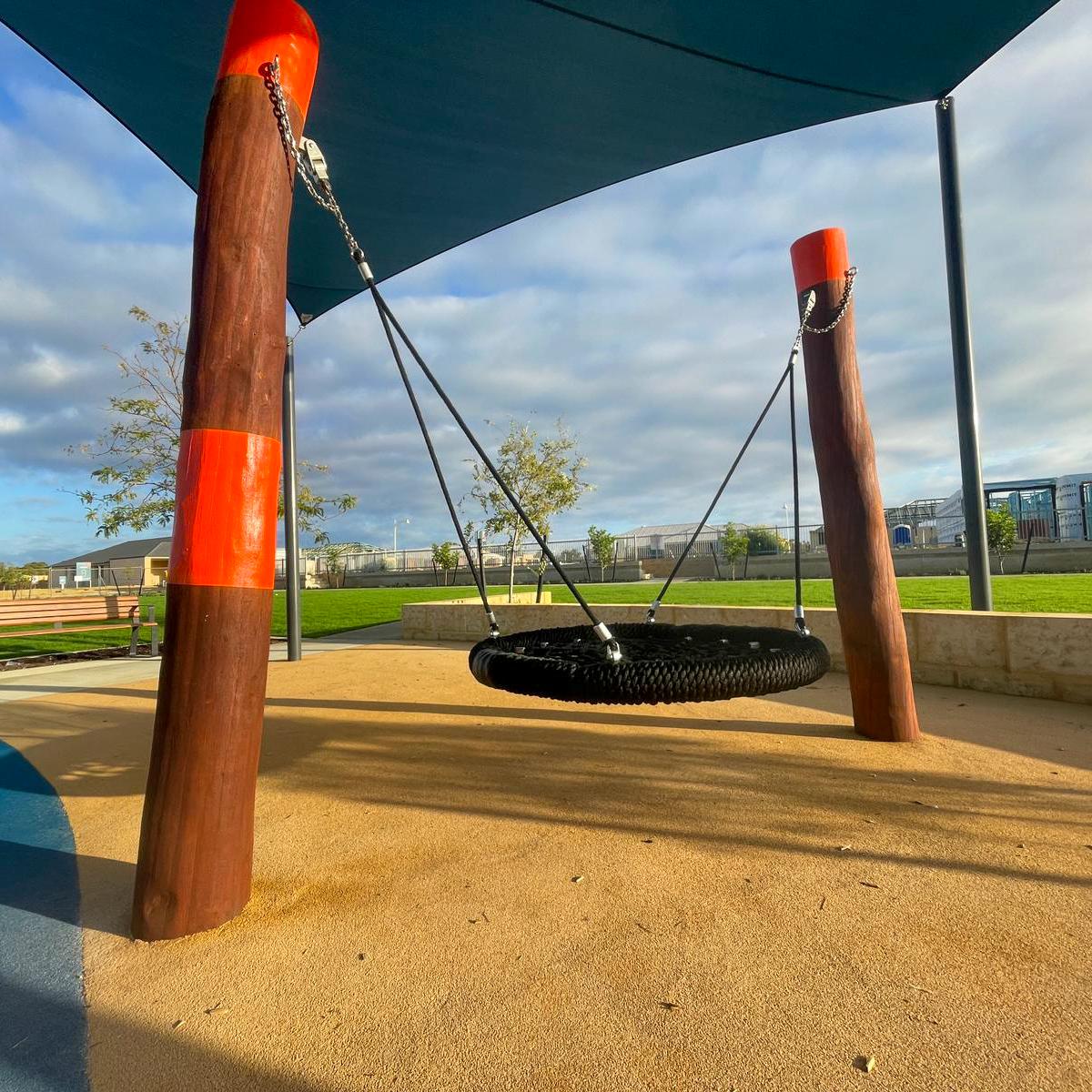 Double Pole Basket Swing | Offer robust, inclusive swinging with this Double Pole Basket Swing, featuring a sturdy Jarrah bush pole frame and a large basket seat ideal for high-use public spaces. | VRI