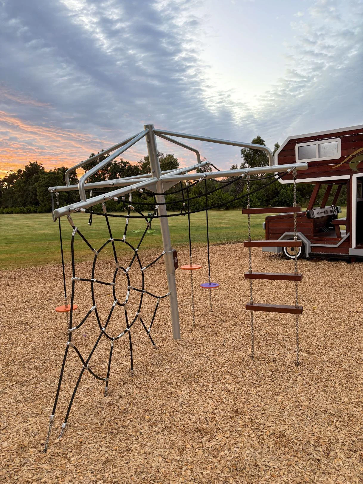 432-CLC Clothesline Climber — spider web rope net close view with orange and purple pommel discs, Dunsborough Big4 Holiday Park WA