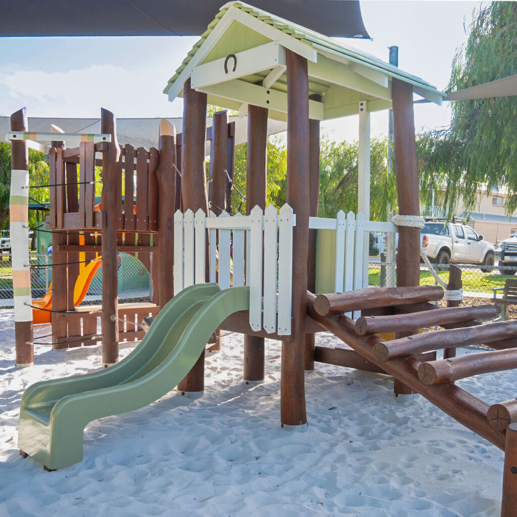 172-GFO Giddy-Up Forts — main Jarrah adventure fort with orange slide under shade sail, Parmelia Park Fremantle