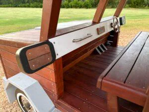 524-MTH Motorhome — cab side entry showing Jarrah bench seat, stainless side mirror, stair access and carved Jarrah wheel detail