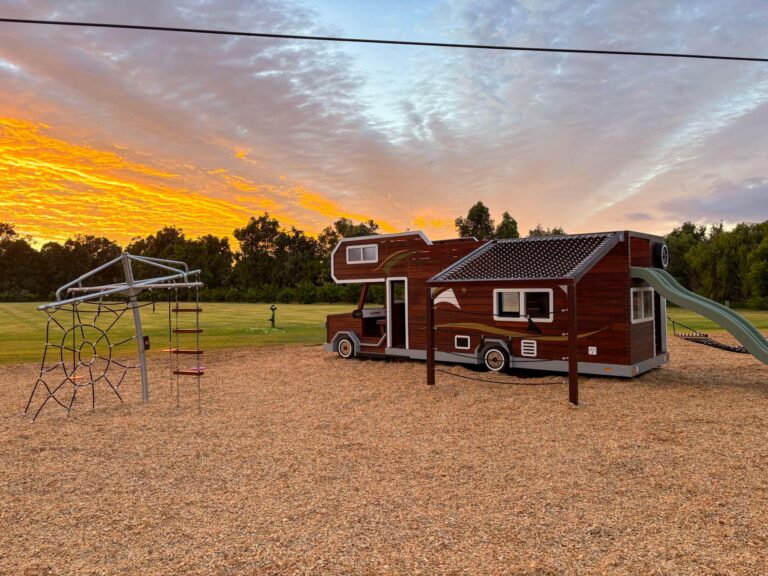 524-MTH Motorhome — driver-side full-length view showing VRI cab-over, Jarrah body panels and rope net awning extension